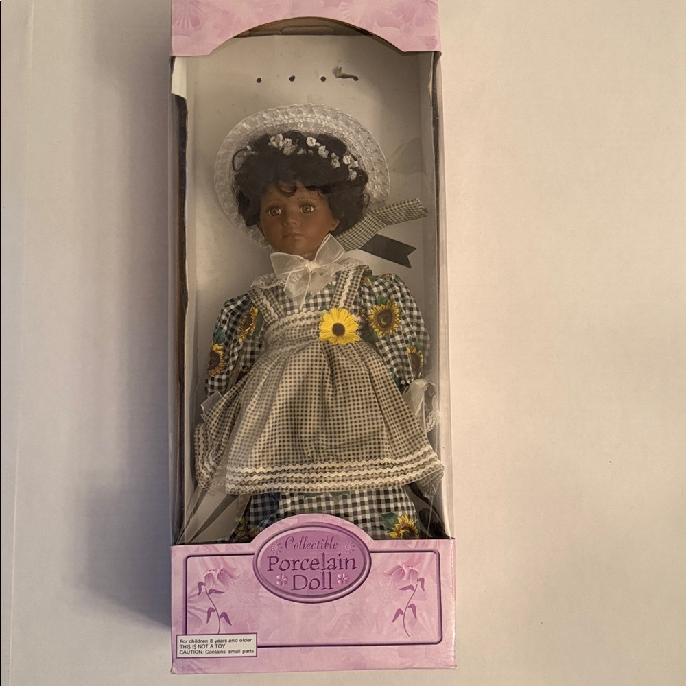 Collectible Bisque Porcelain Doll with Blue Hat and Floral Dress